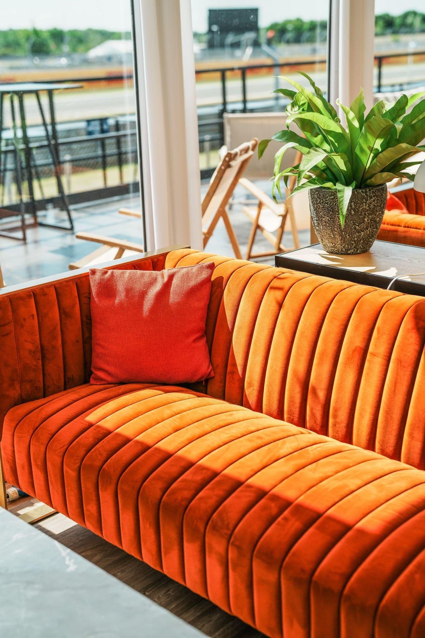 Velvet sofas in the trackside lounge
